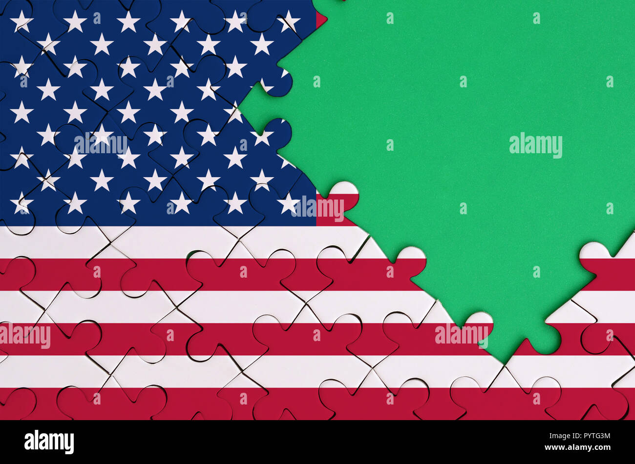 United States Of America Flag Is Depicted On A Completed Jigsaw Puzzle With Free Green Copye On The Right Side United States Of America Flag Is Depicted On A Completed Jigsaw Puzzle With Free Green Copye On The Right Side