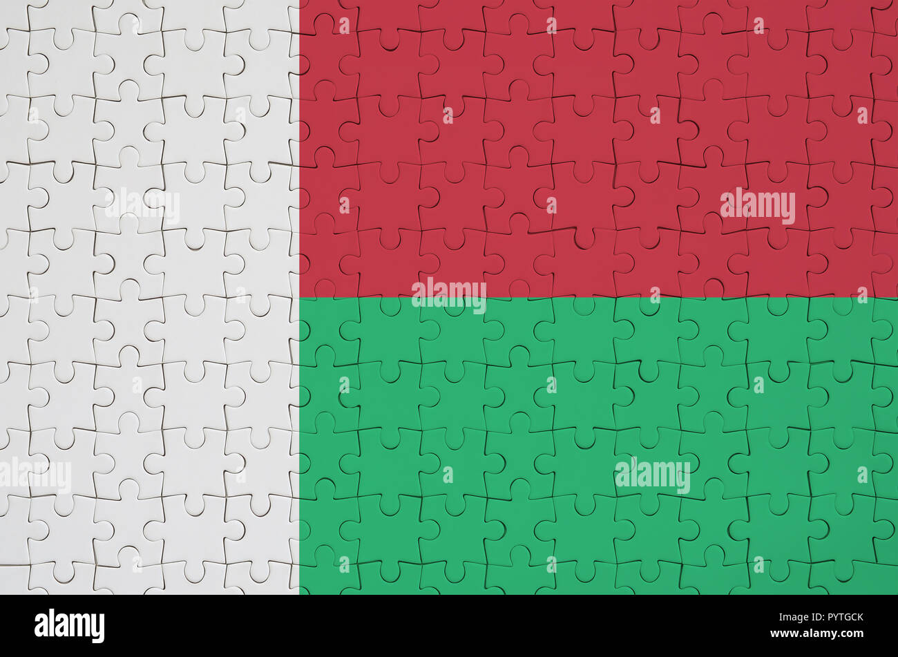 Madagascar flag is depicted on a folded puzzle Stock Photo - Alamy