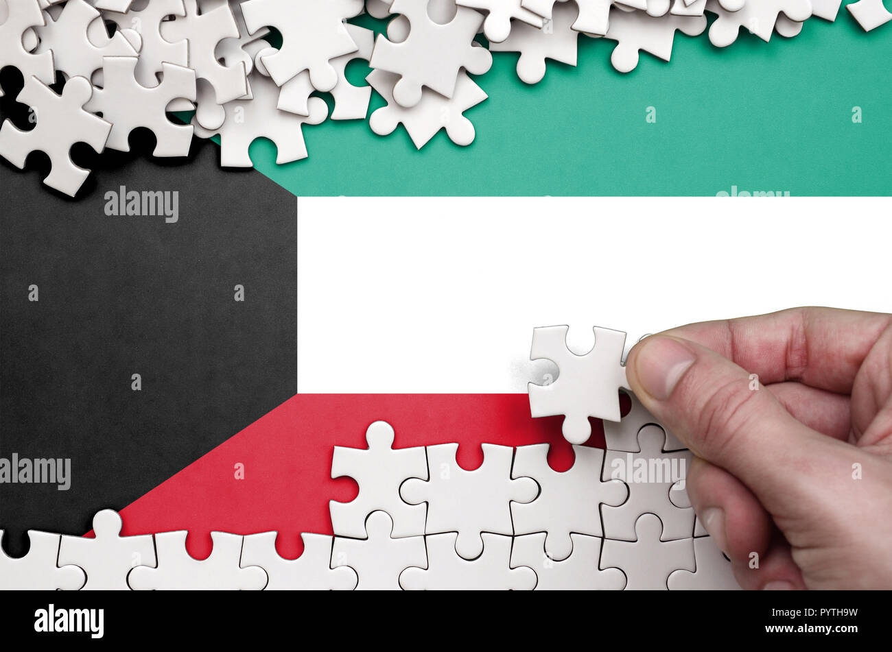 Kuwait flag is depicted on a puzzle hi-res stock photography and images ...