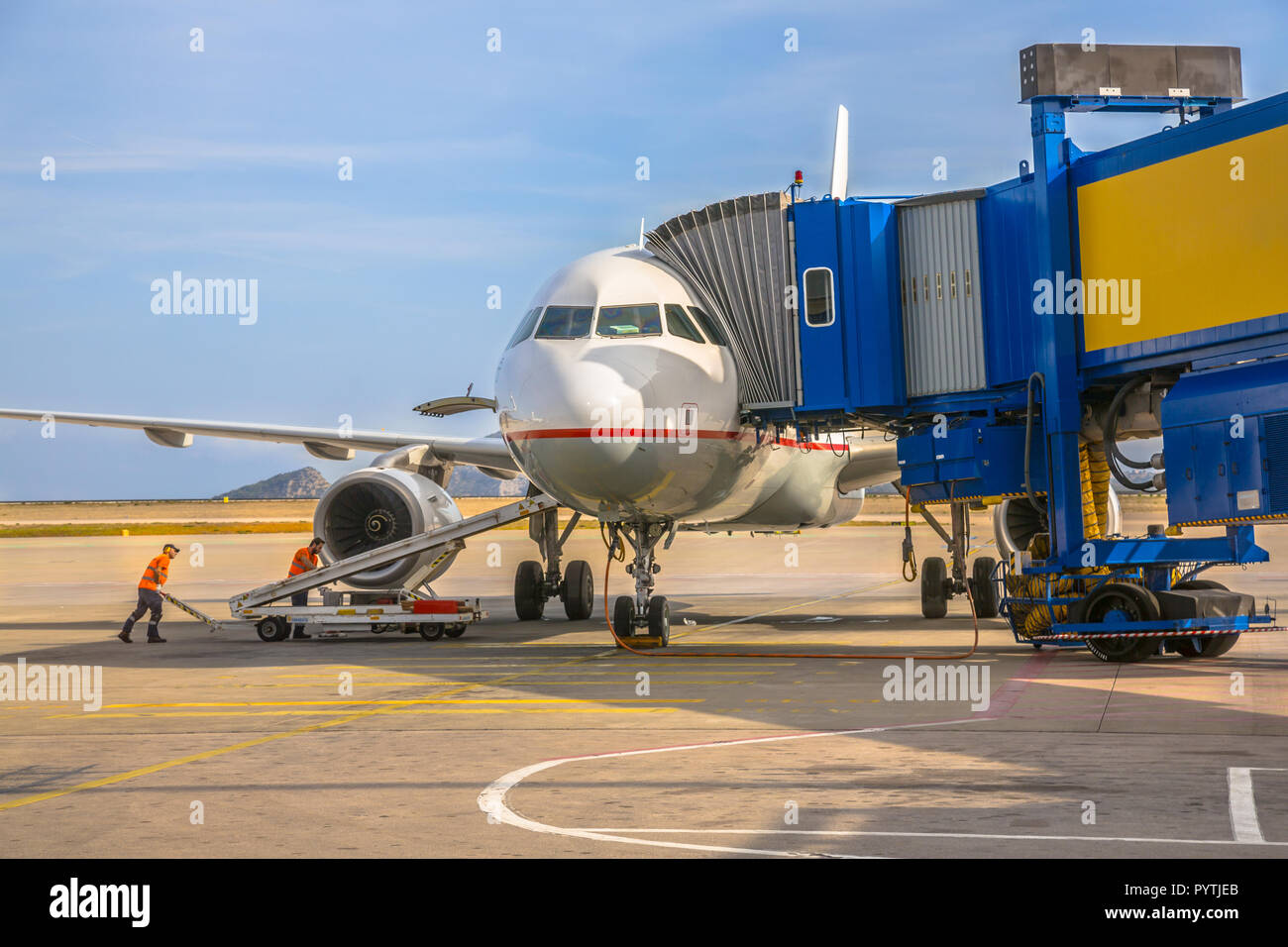 Passenger jet airplane arriving at airport gate terminal on Athens