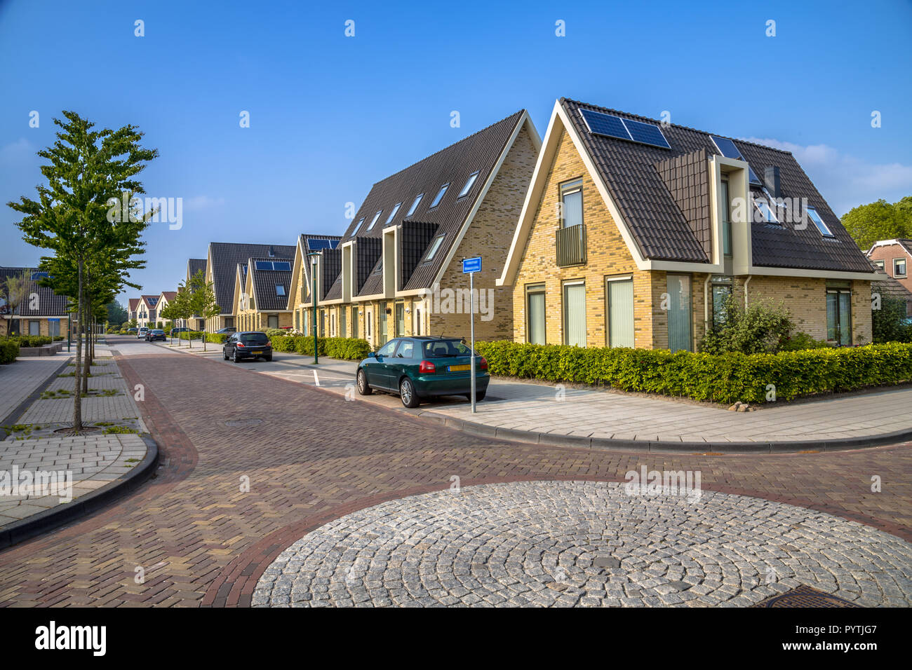 Contemporary family houses in residential street of middle sized city in Friesland Stock Photo