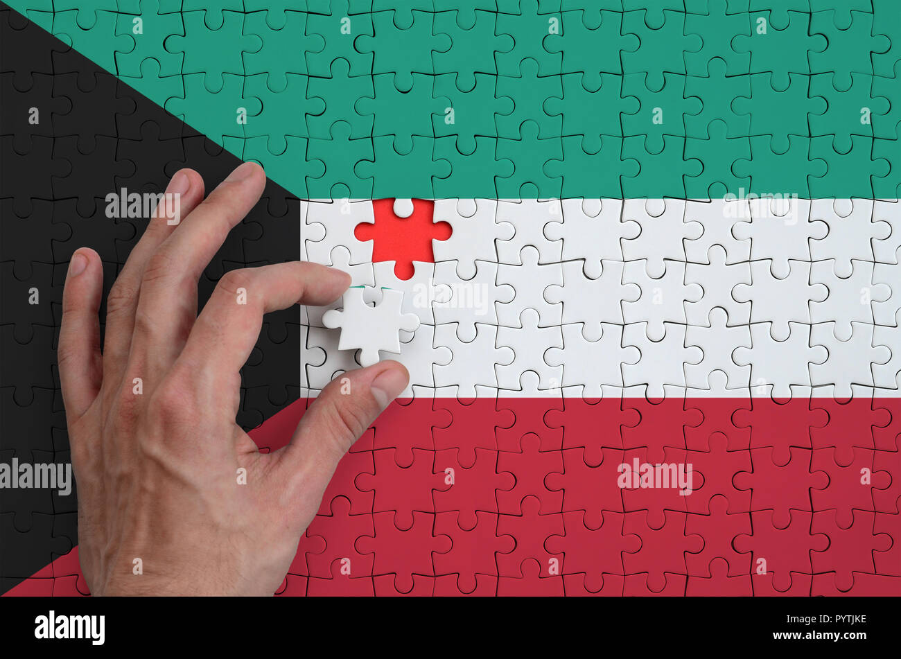 Kuwait flag is depicted on a puzzle hi-res stock photography and images ...
