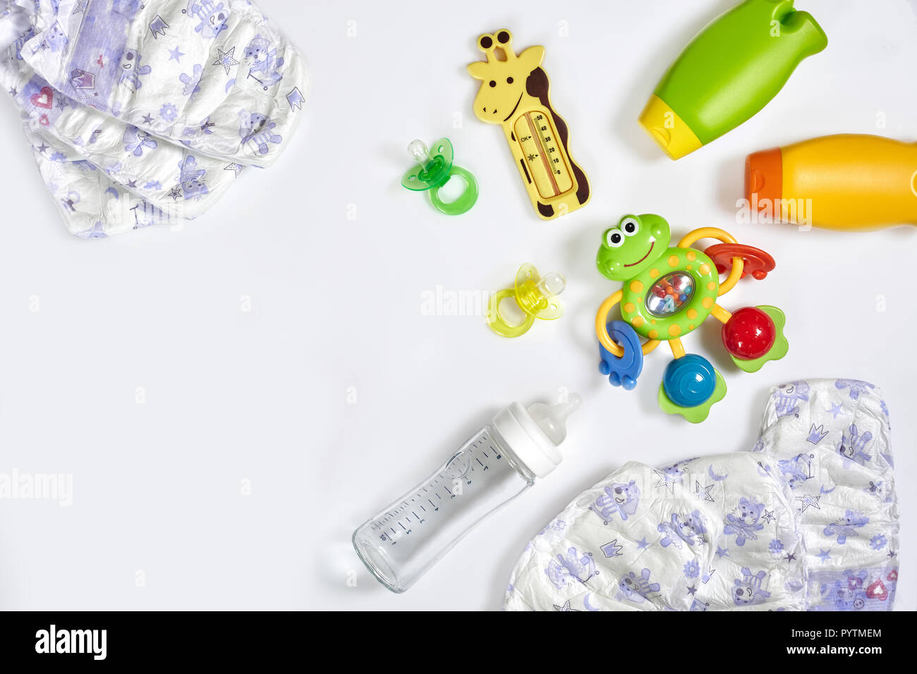 Set of accessories for baby. Pacifier, bottle, diaper, cream on white ...
