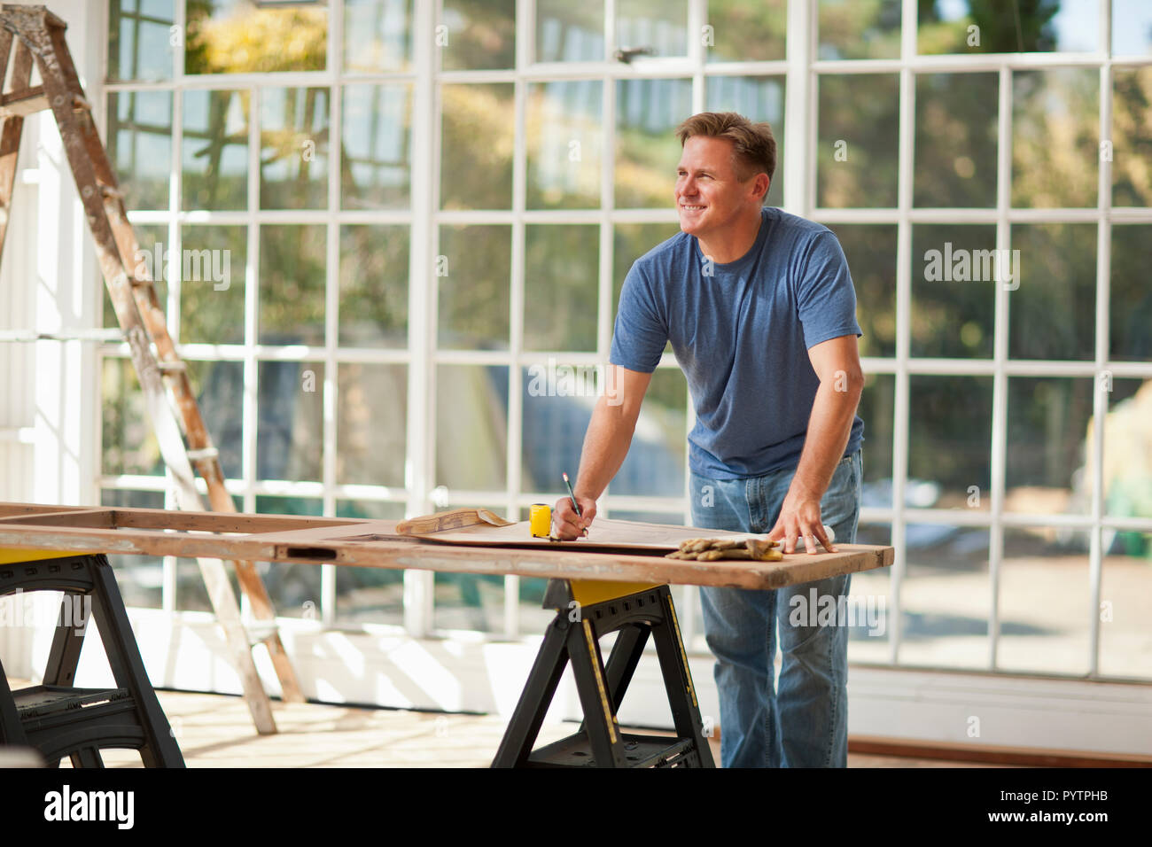 Mid adult man working on a construction site. Stock Photo