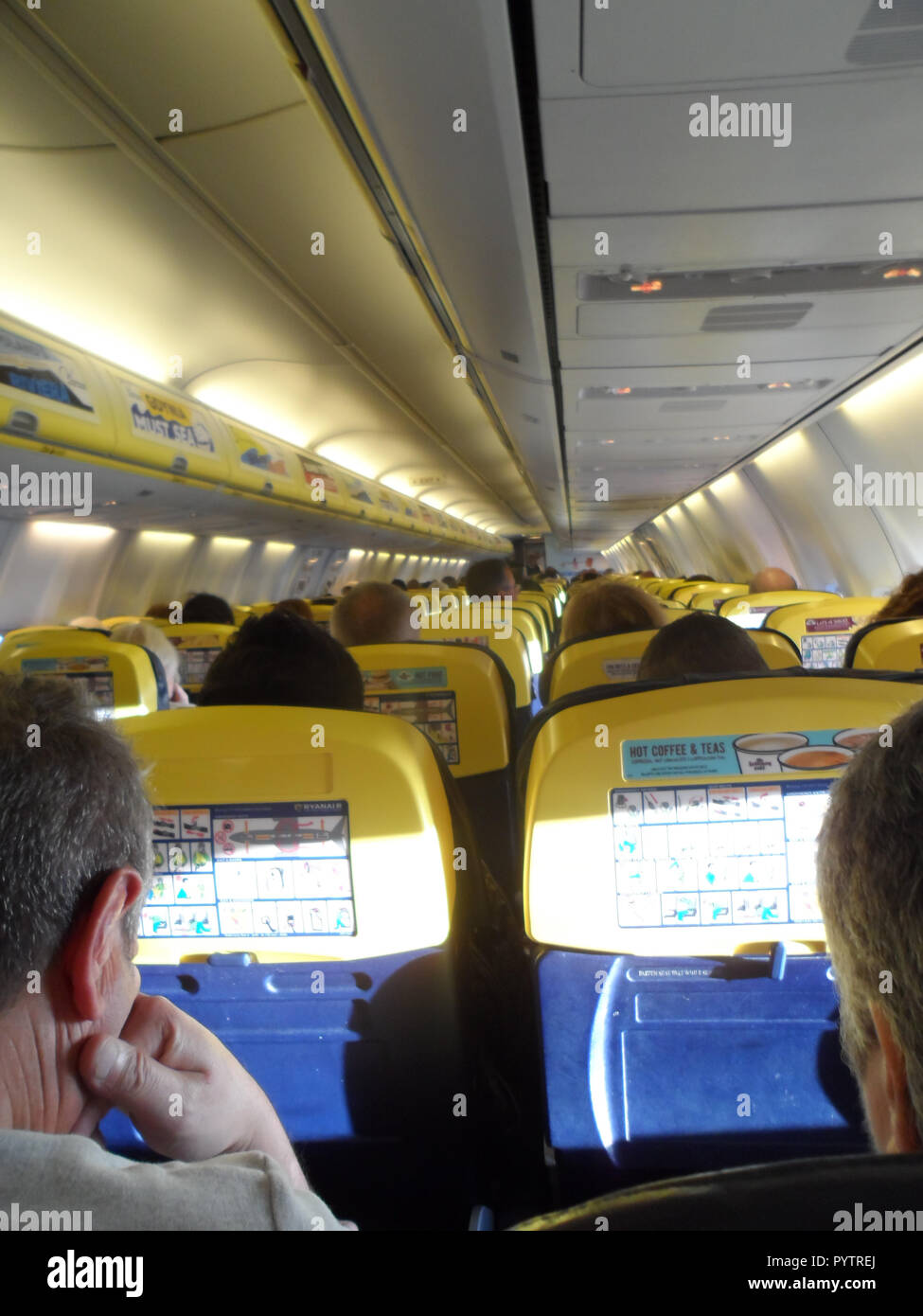 Interior of the cabin of a Boeing 757 Ryanair economy class commercial aircraft. Stock Photo