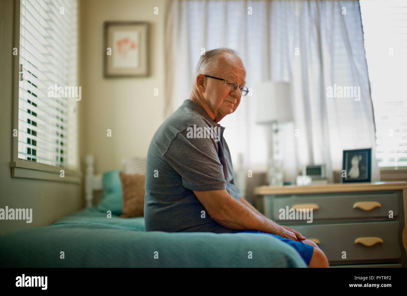 Old man sitting on bed hi-res stock photography and images - Alamy