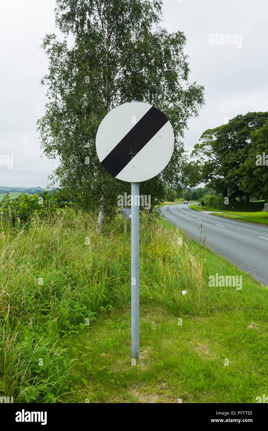 National speed limit sign on the A6 road north-east of Kendal, Cumbria. The road is a single carriageway without street lighting, so has 60 mph limit Stock Photo