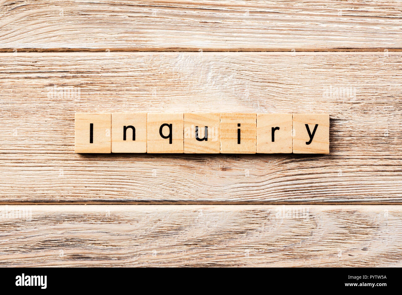 inquiry word written on wood block. inquiry text on table, concept ...