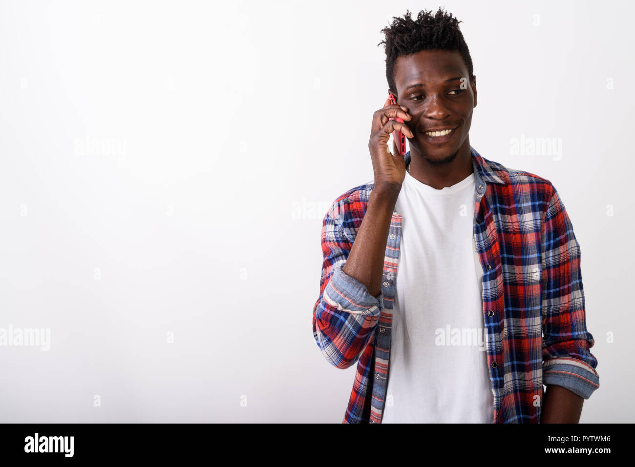 Studio shot of young happy black African man smiling while think Stock ...