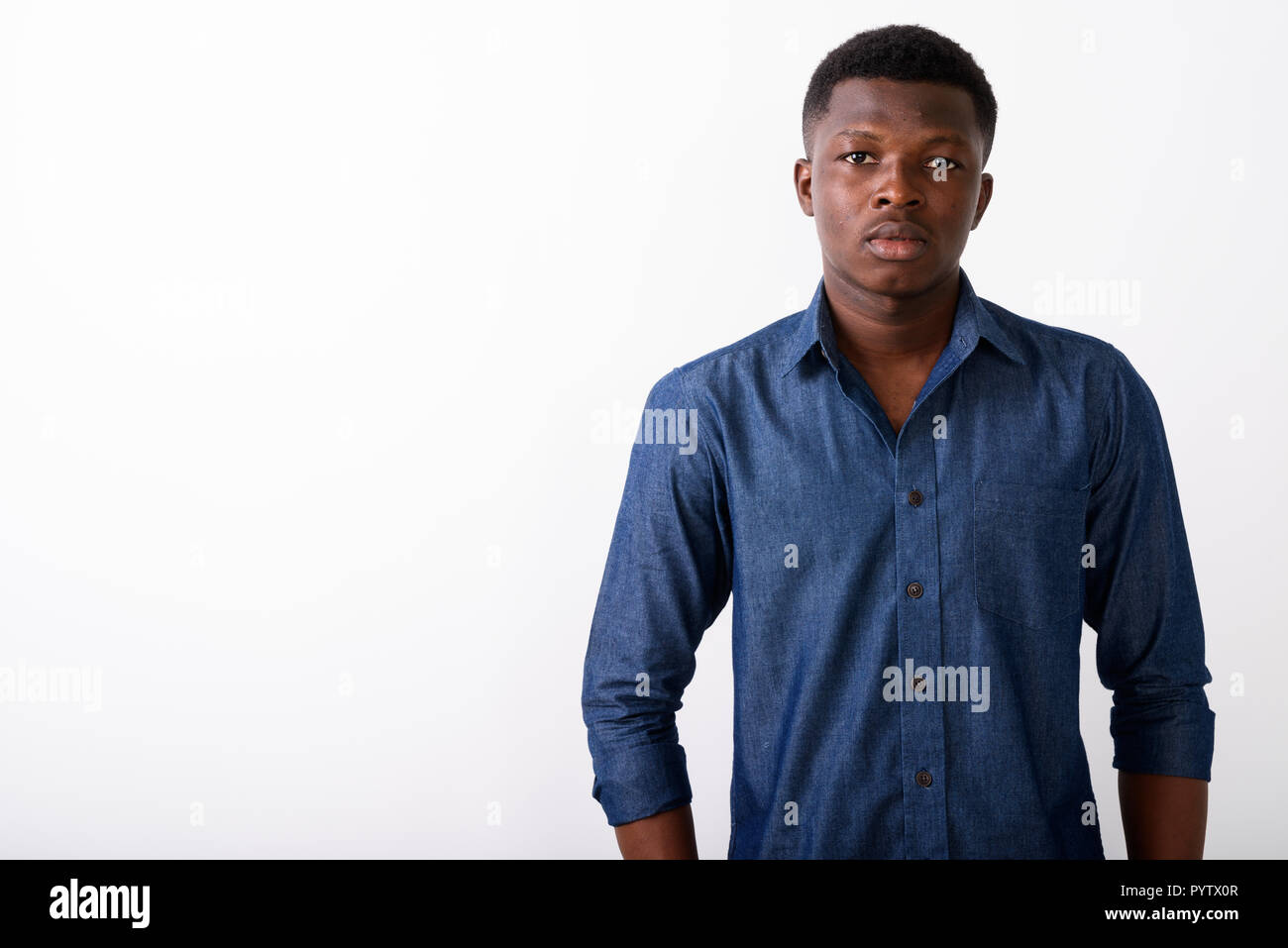 Portrait of young black African man against white background Stock Photo