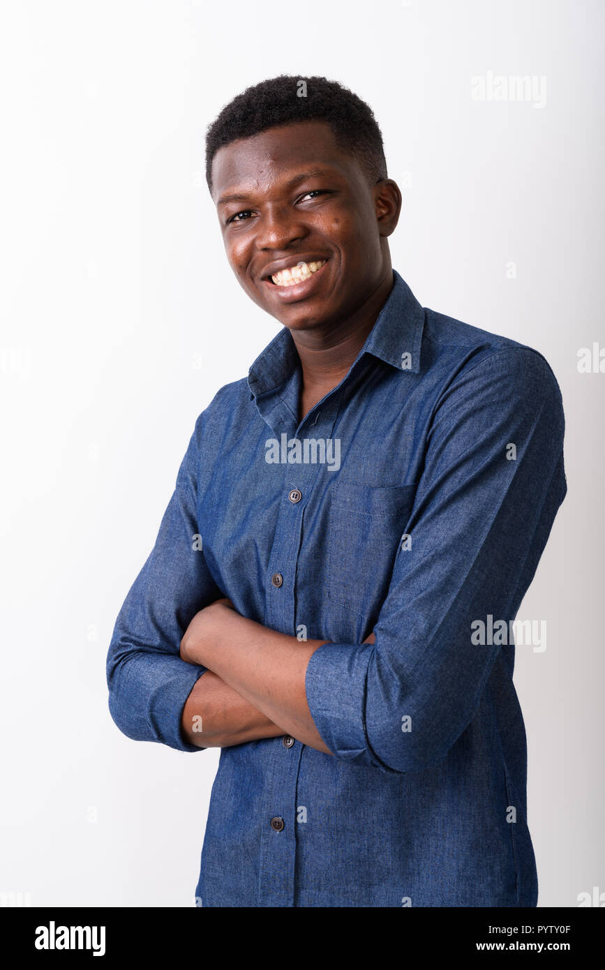 Studio shot of young happy black African man smiling with arms c Stock ...