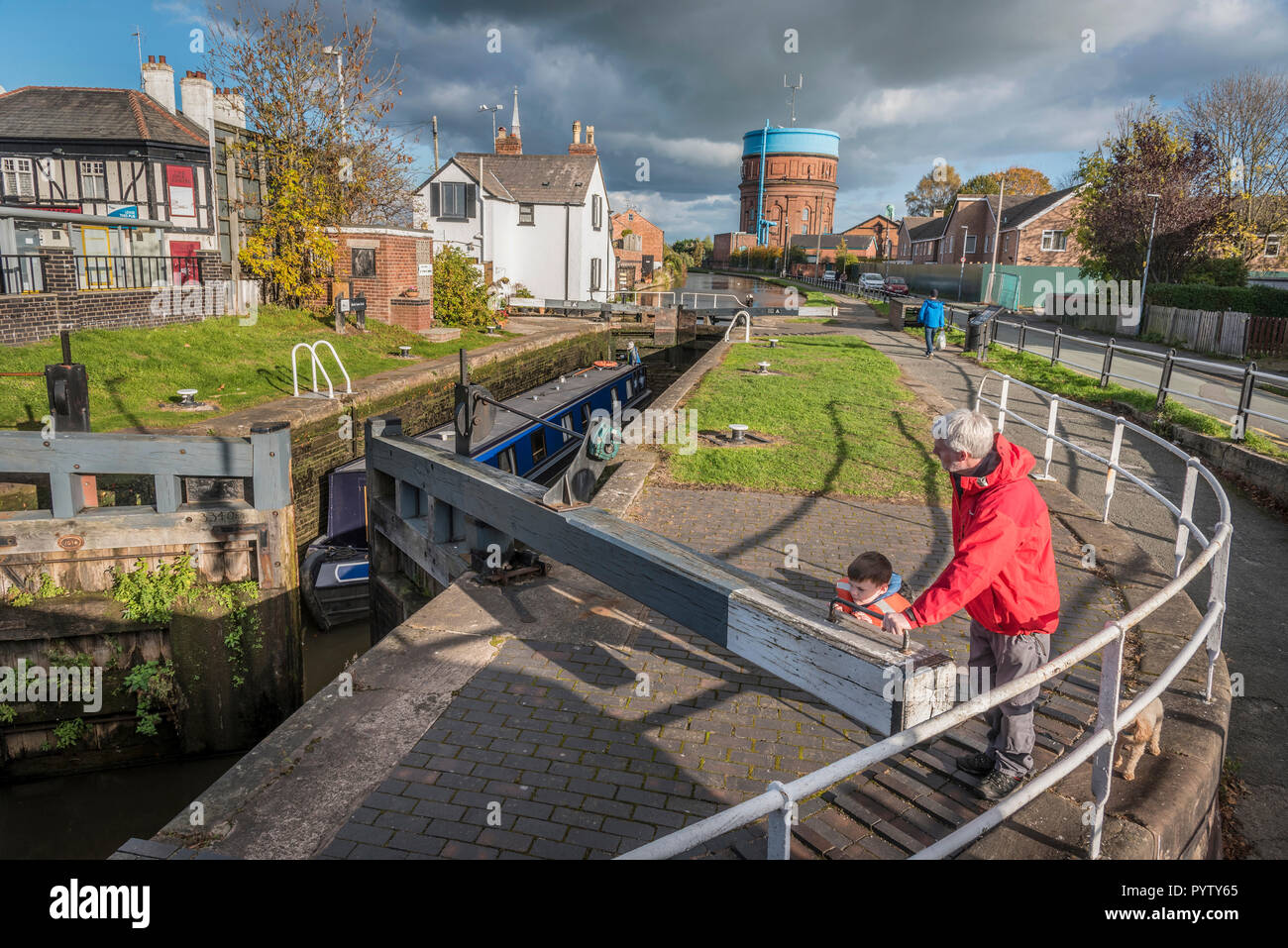Chester North West England Chester North West England.Locking a canal narrowboat through the lock at Spital Walk. The Shropshire Union canal. Stock Photo