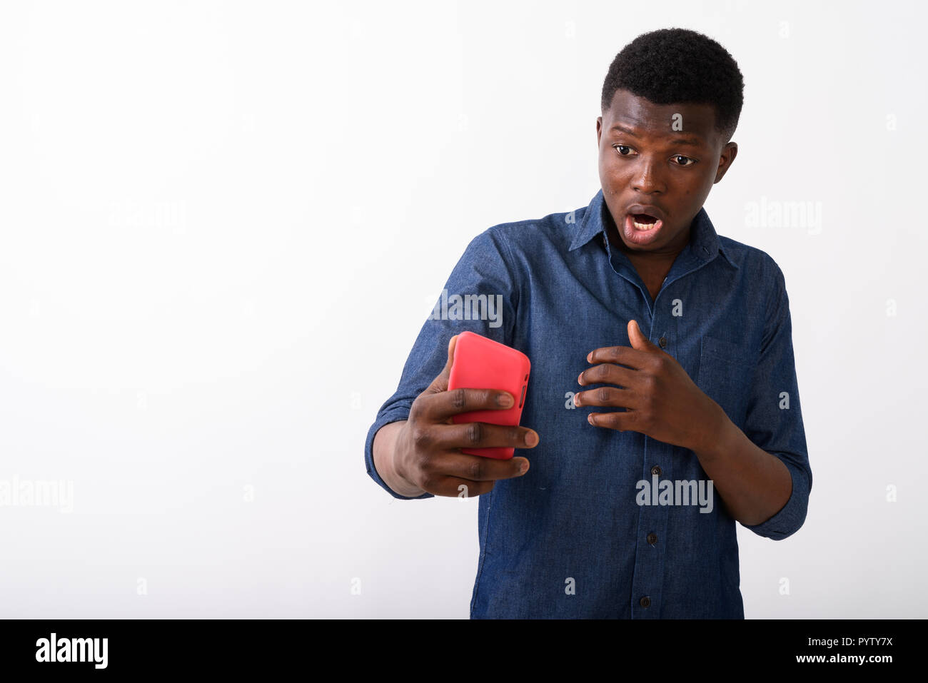 Shocked african man holding hi-res stock photography and images - Alamy