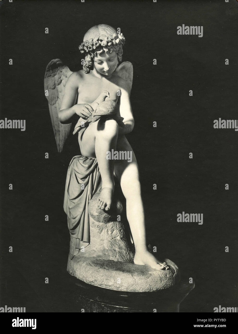 Cupid gives love water to two doves, statue by Bienaimè in Villa Carlotta, Italy 1930s Stock Photo