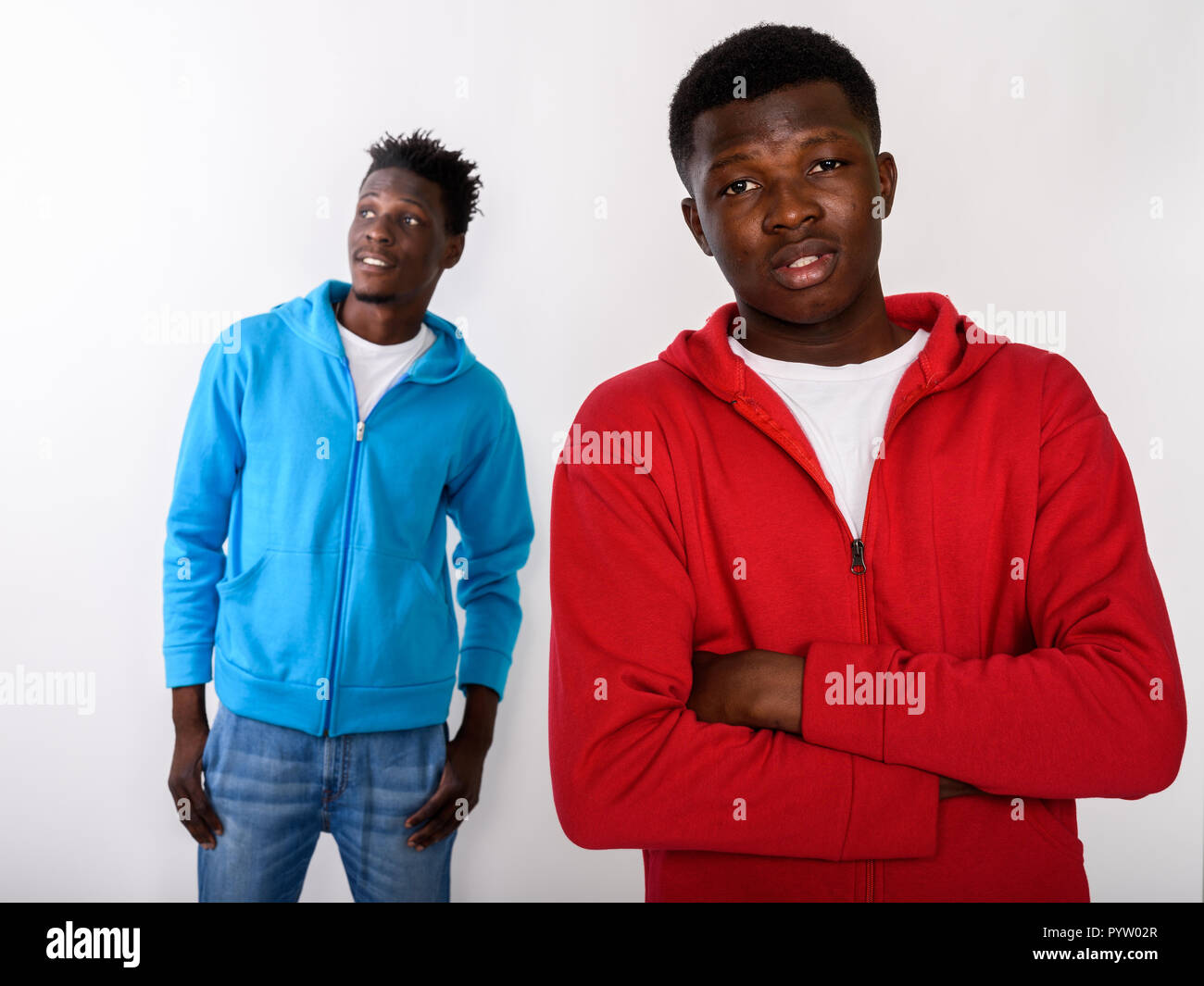 Studio shot of young black African man with arms crossed and one Stock ...
