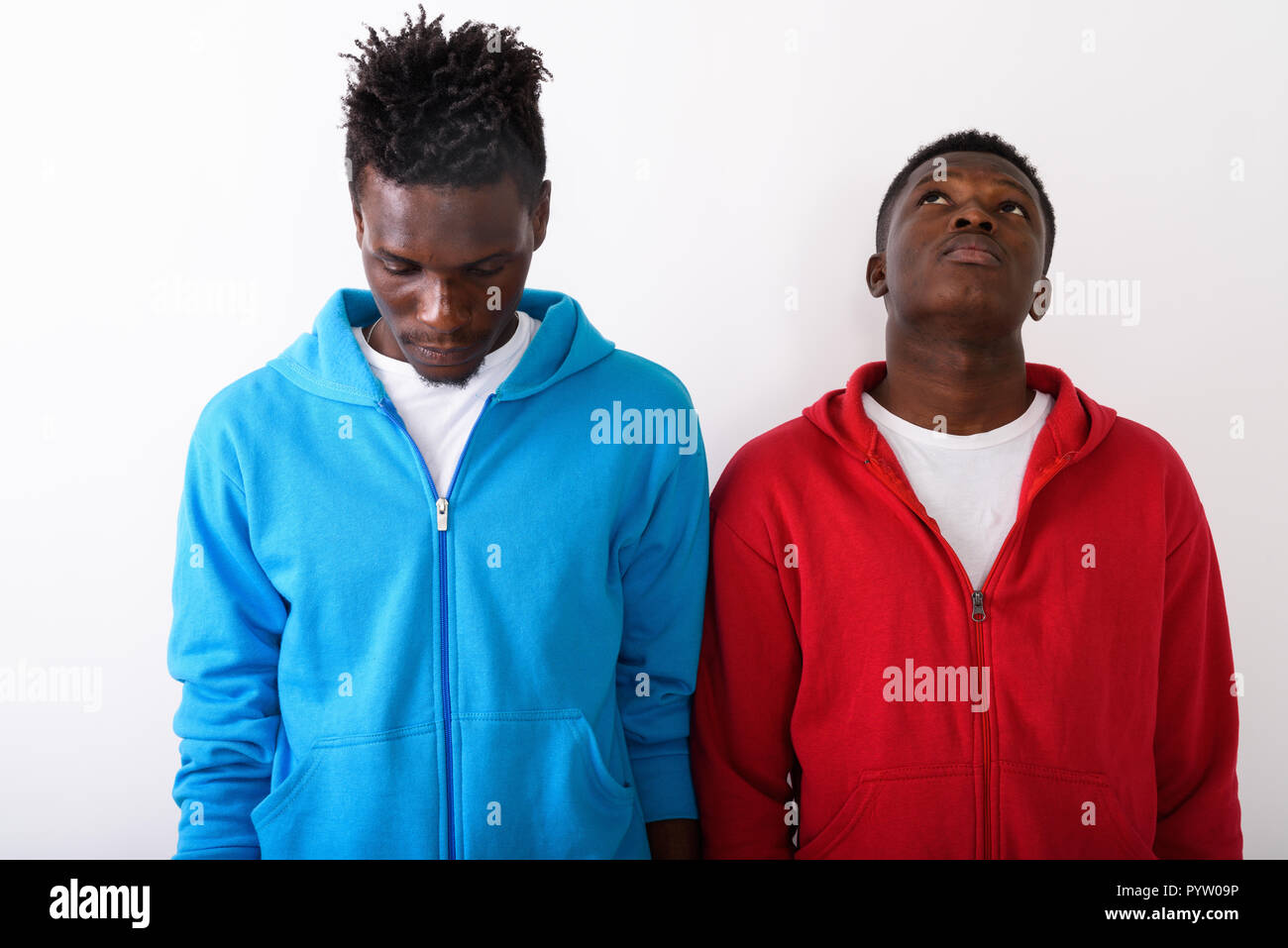 Studio shot of young black African man looking up with young sli Stock ...