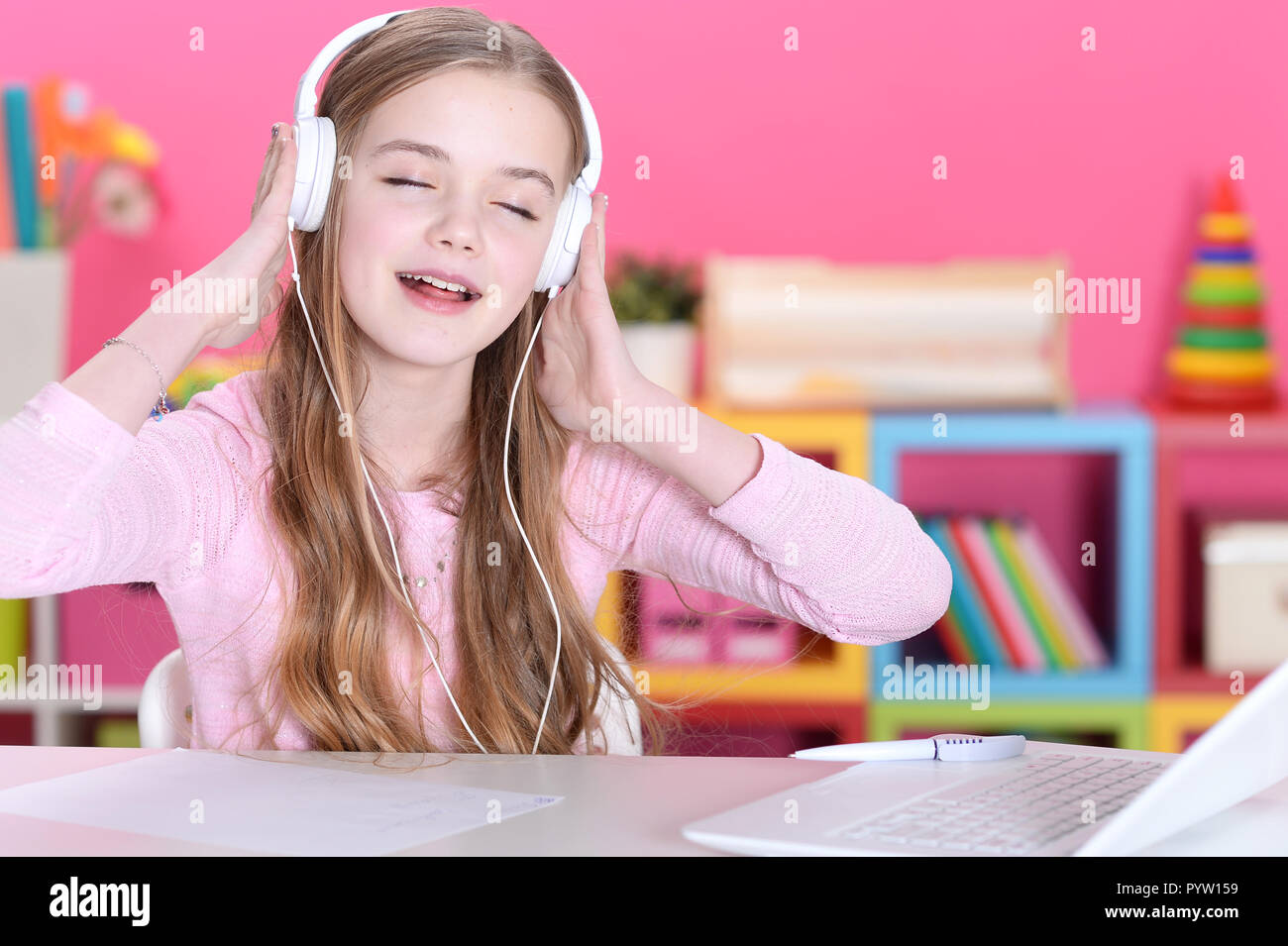 Portrait of beautiful cute girl using laptop Stock Photo - Alamy