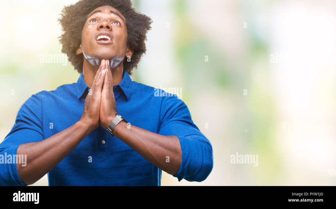 Afro american man over isolated background begging and praying with ...