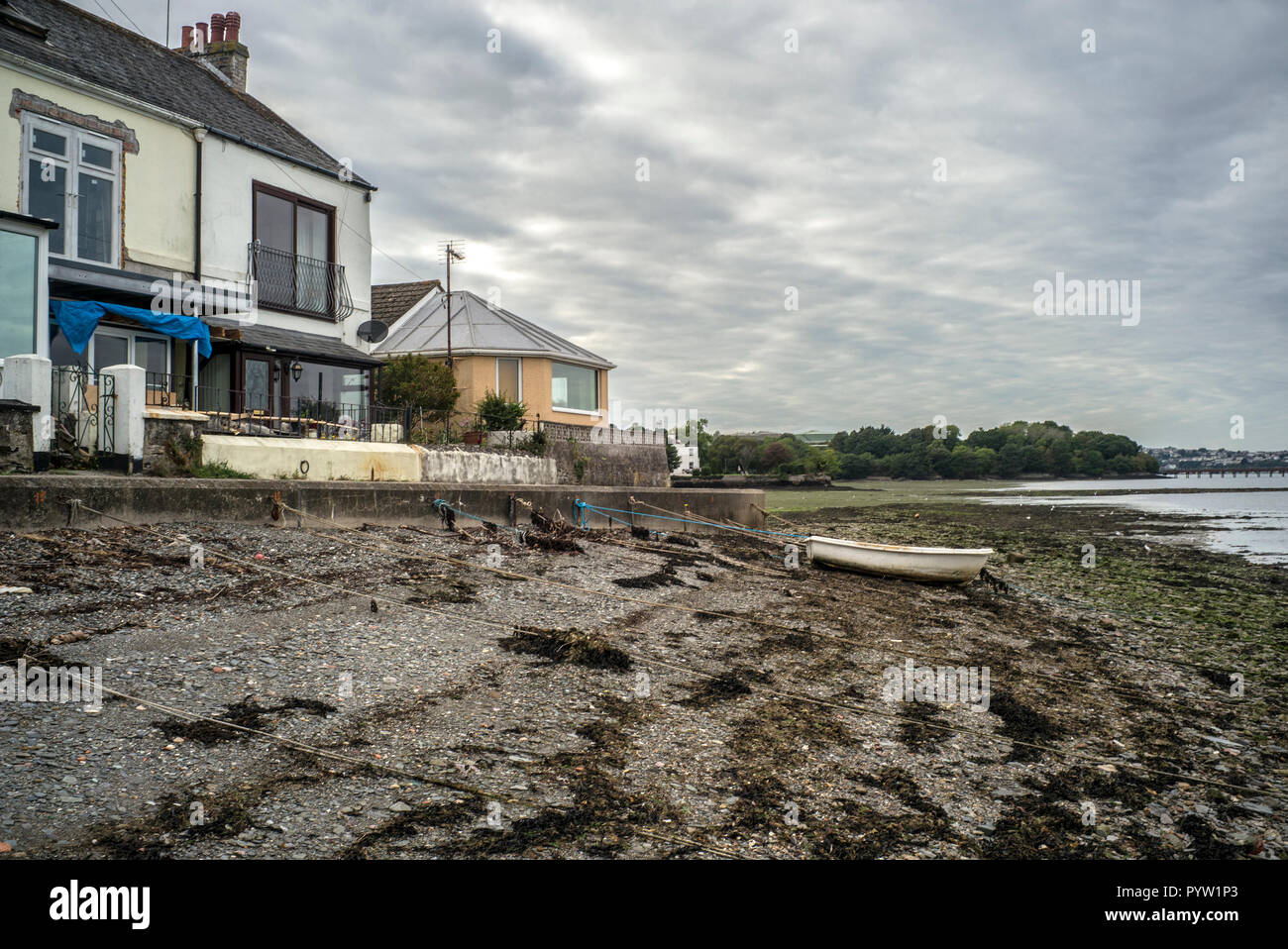House on waterside at Torpoint on the Tamar river dividing Cornwall and