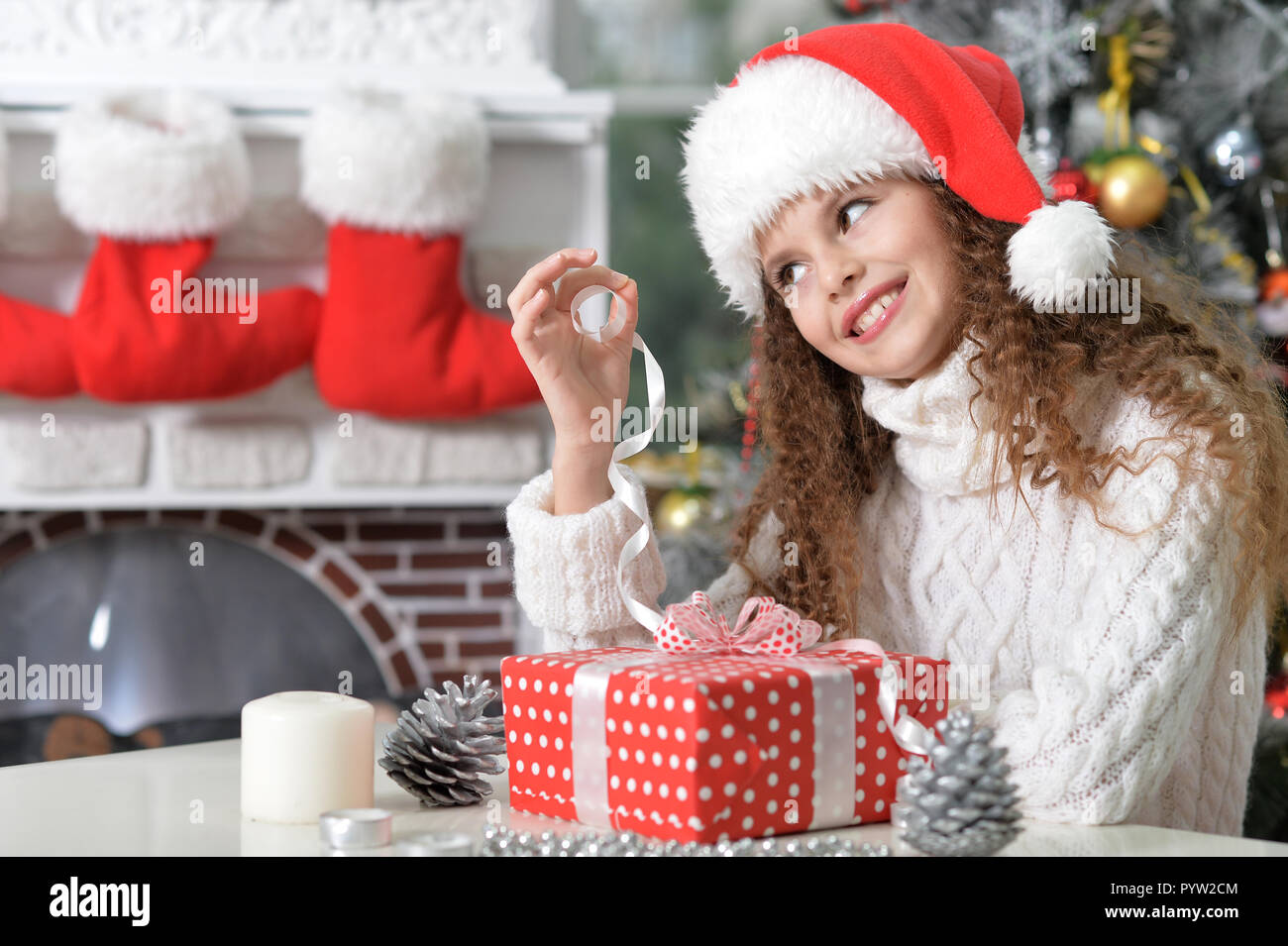 Portrait of beautiful little girl with Christmas present Stock Photo ...