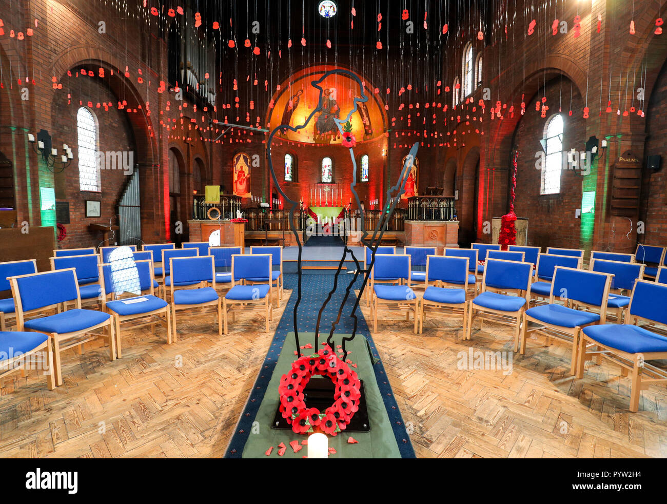 The Swindon Borough Council Tommy silhouette on display inside St Augustine's Church, Even Swindon, Wiltshire, where 1300 poppies hang from the roof to represent the lives lost in the local area during World War I. Stock Photo