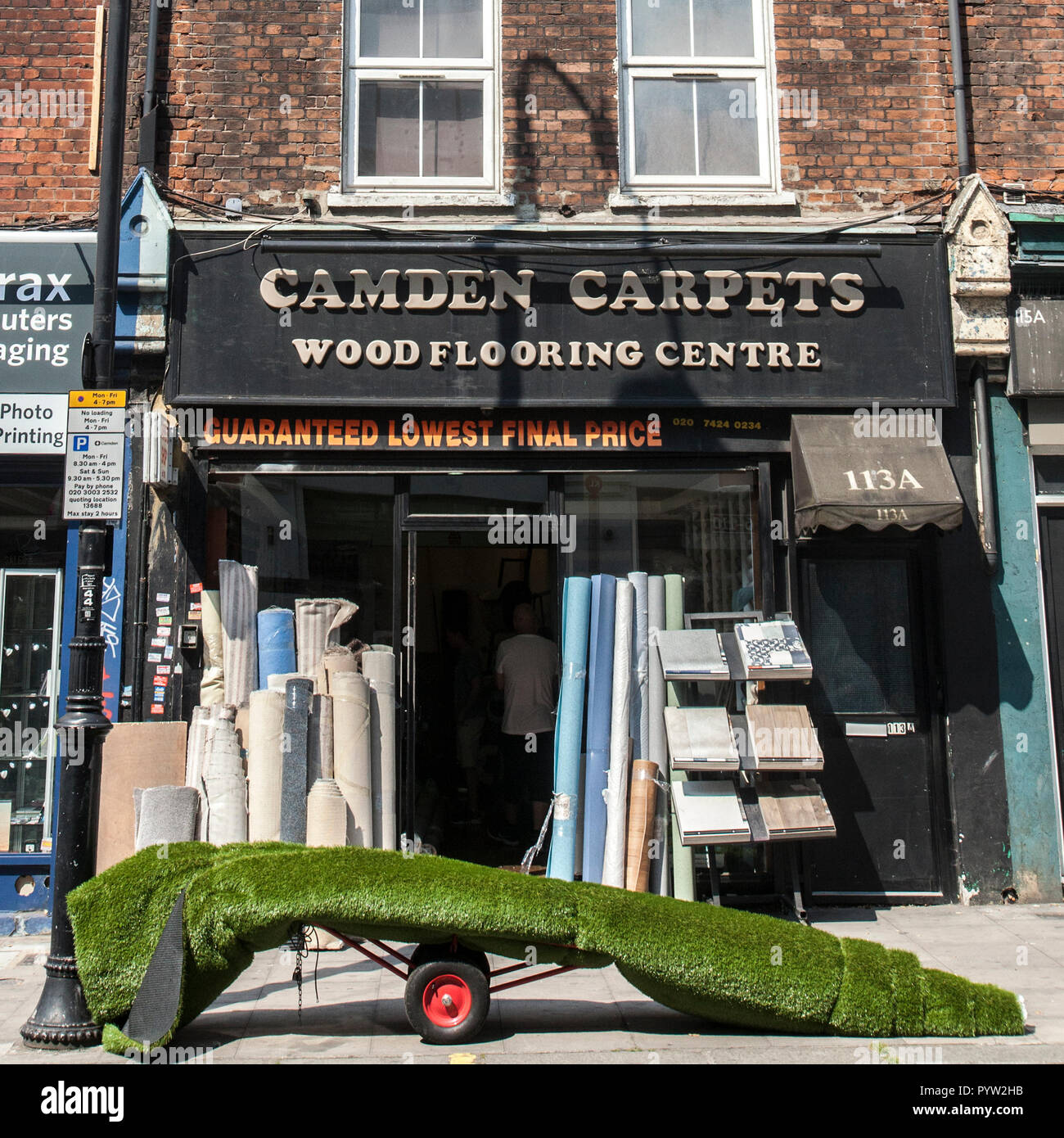 Camden carpet shop with roll of fake grass Stock Photo