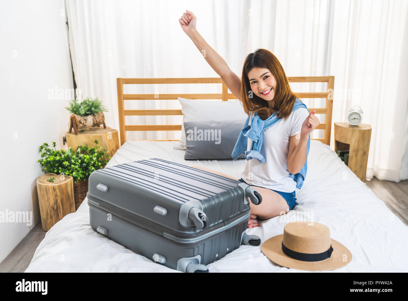 Young girl preparing luggage travel hi res stock photography and images Alamy