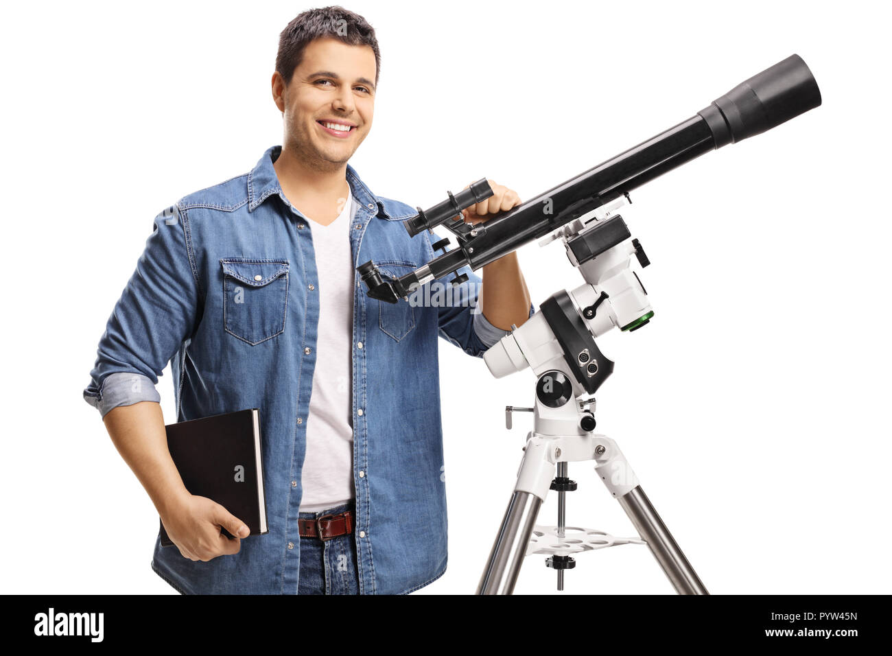 Smiling young man with a telescope isolated on white background Stock Photo