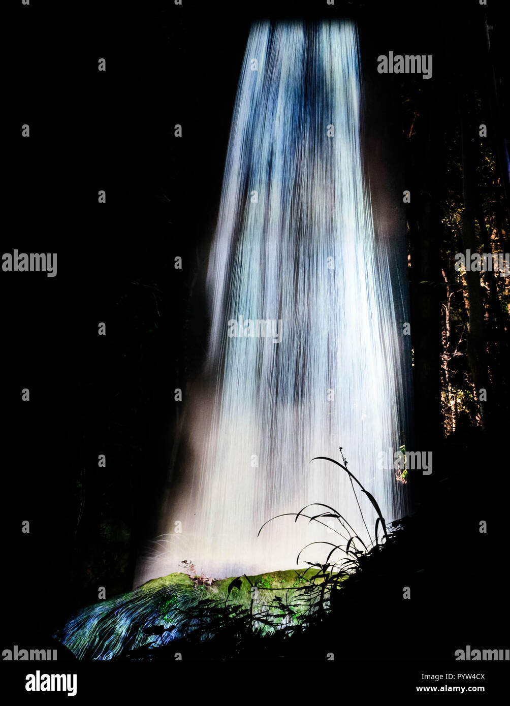 Artificial waterfall at night at Mifuneyama Rakuen Garden in Saga, Japan. Stock Photo