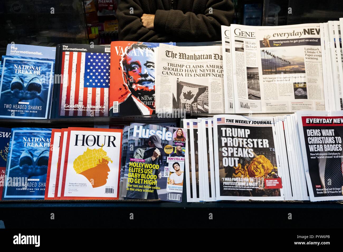 New York, NY, USA. 30th Oct, 2018. The ''first-of-its-kind'' ''Misinformation Newsstand'' on Sixth Avenue and 42nd Street, one block from Times Square, in New York City, New York on October 30, 2018. The Columbia Journalism Review (CJR) erected it ''to educate news consumers about the dangers of disinformation in the lead-up to midterms''. The newsstand contains totally fake periodicals with fake headlines and articles. Quoted sections of this caption were taken from the CJR press release about the newsstand. Credit: Michael Brochstein/ZUMA Wire/Alamy Live News Stock Photo