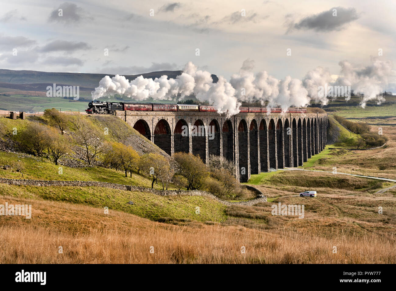 Ribblehead Viaduct, North Yorkshire, UK. 30th October, 2018. Under an Autumn sky 'The Dalesman' steam special crosses Ribblehead Viaduct in the Yorkshire Dales National Park. The train is en route to Carlisle on the famous Settle-Carlisle railway line. The train is hauled by a vintage Stanier 8F locomotive originally built for the London Midland and Scottish Railway Company (LMS). Credit: John Bentley/Alamy Live News Stock Photo