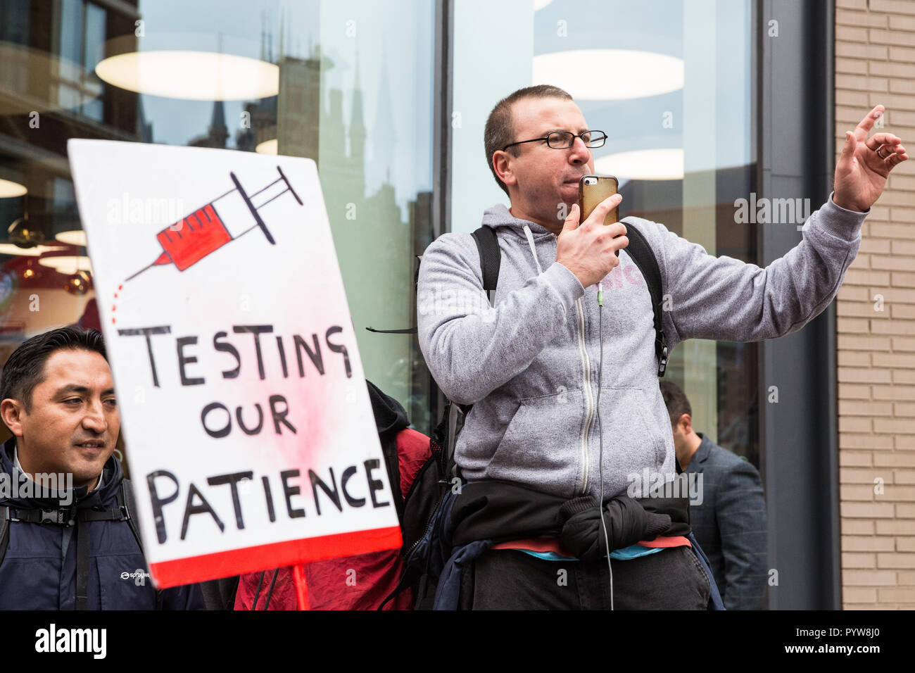 London, UK. 30th October, 2018. Jason Moyer-Lee, General Secretary of the Independent Workers of Great Britain (IWGB) trade union, addresses union members and precarious workers after a march from the offices of Transport for London to the University of London via the Court of Appeal in support of Uber drivers who are seeking employment rights. The Court of Appeal will today hear an appeal by Uber against a ruling that its drivers are employees rather than self-employed workers. Credit: Mark Kerrison/Alamy Live News Stock Photo