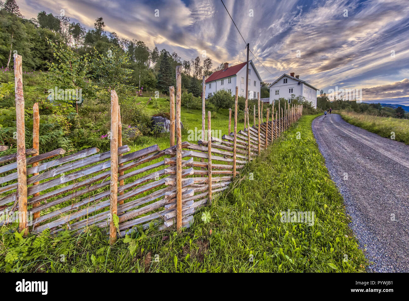 LILLEHAMMER, NORWAY - AUGUST 01, 2016: Norwegian House with traditional roundpole wooden fence Stock Photo