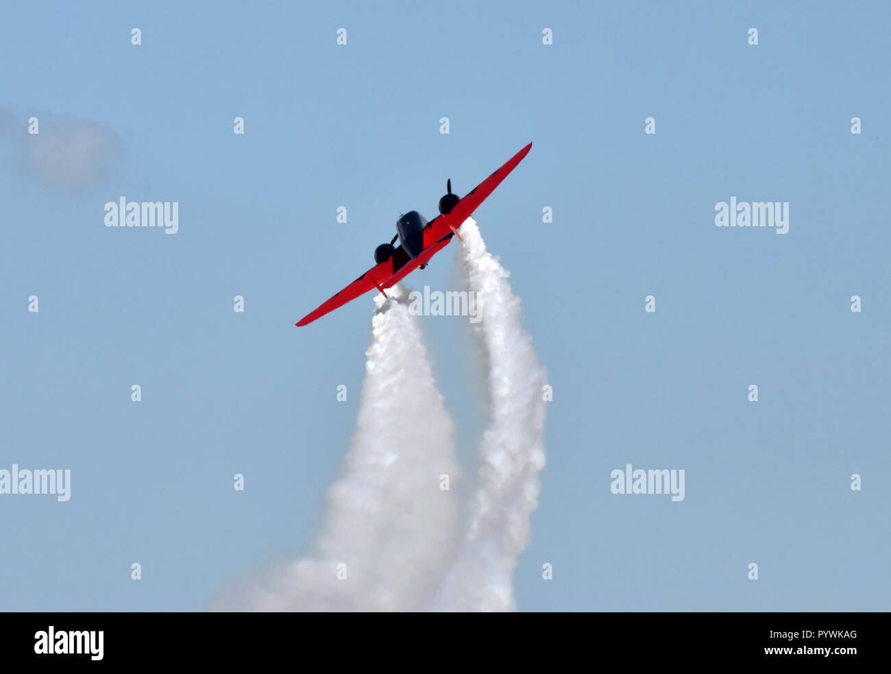 Retro propeller airplane soaring into the sky Stock Photo