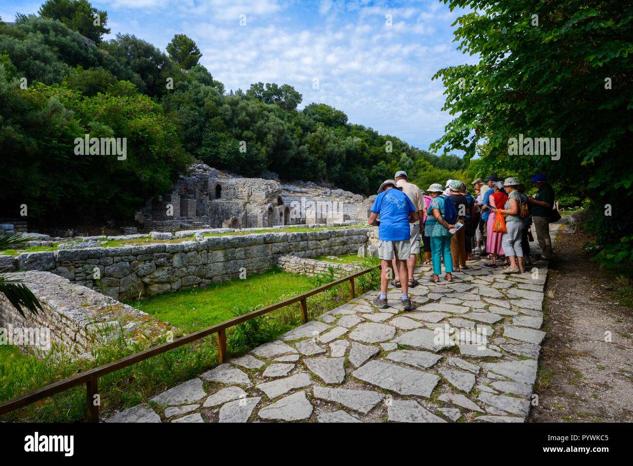 ALBANIA, BUTRINT. A tourist group admires the ruins of the antique city in southern Albania. Stock Photo