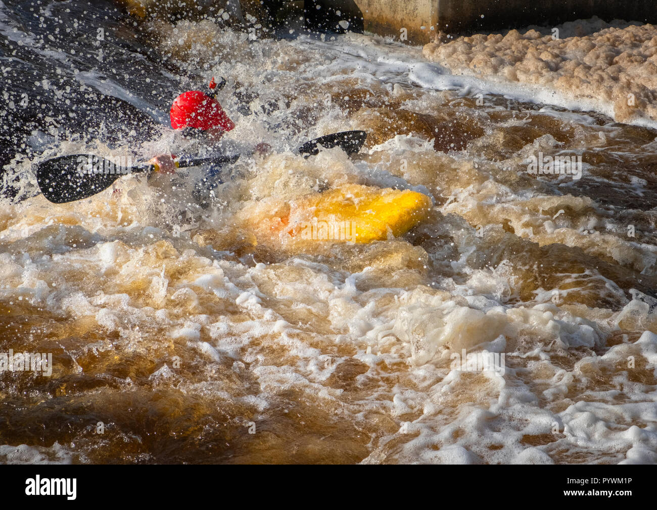 Canoeist negotiating the Tees Barrage International White Water Course Park in Stockton-on-Tees - formerly Teesside White Water Course Stock Photo