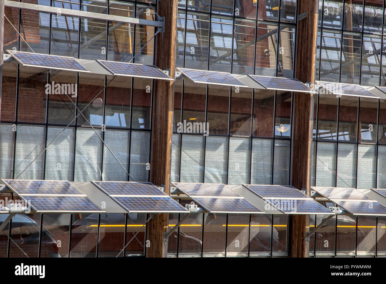 Alternative way of using solar panels on the Front of an Office Building as a Solution for Global Warming Stock Photo