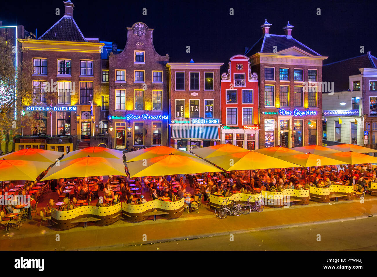 GRONINGEN, THE NETHERLANDS-MAY 5,2015: Students on teracces in the night. Famous bars and restaurants in the old center of the university town of Gron Stock Photo