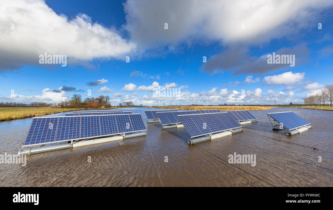Floating solar panels on unused water bodies can represent a serious alternative to ground mounted solar systems Stock Photo