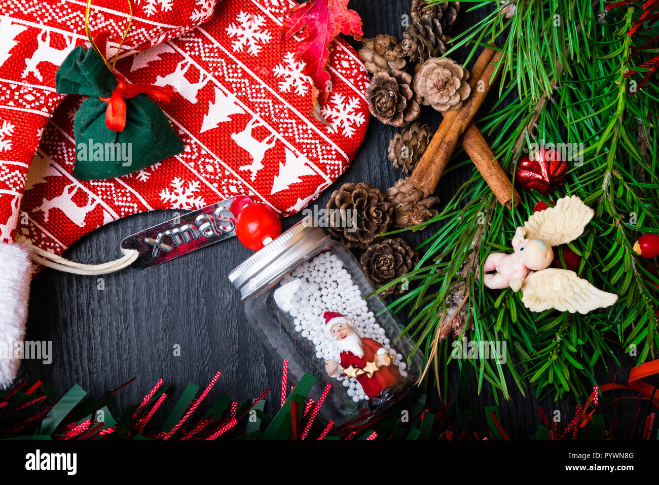 Christmas Socks With Present Gift Berry Garland Santa Claus Cones Cinnamon Christmas Decoration Stocking And Toys Hanging Over Wooden Background Stock Photo Alamy