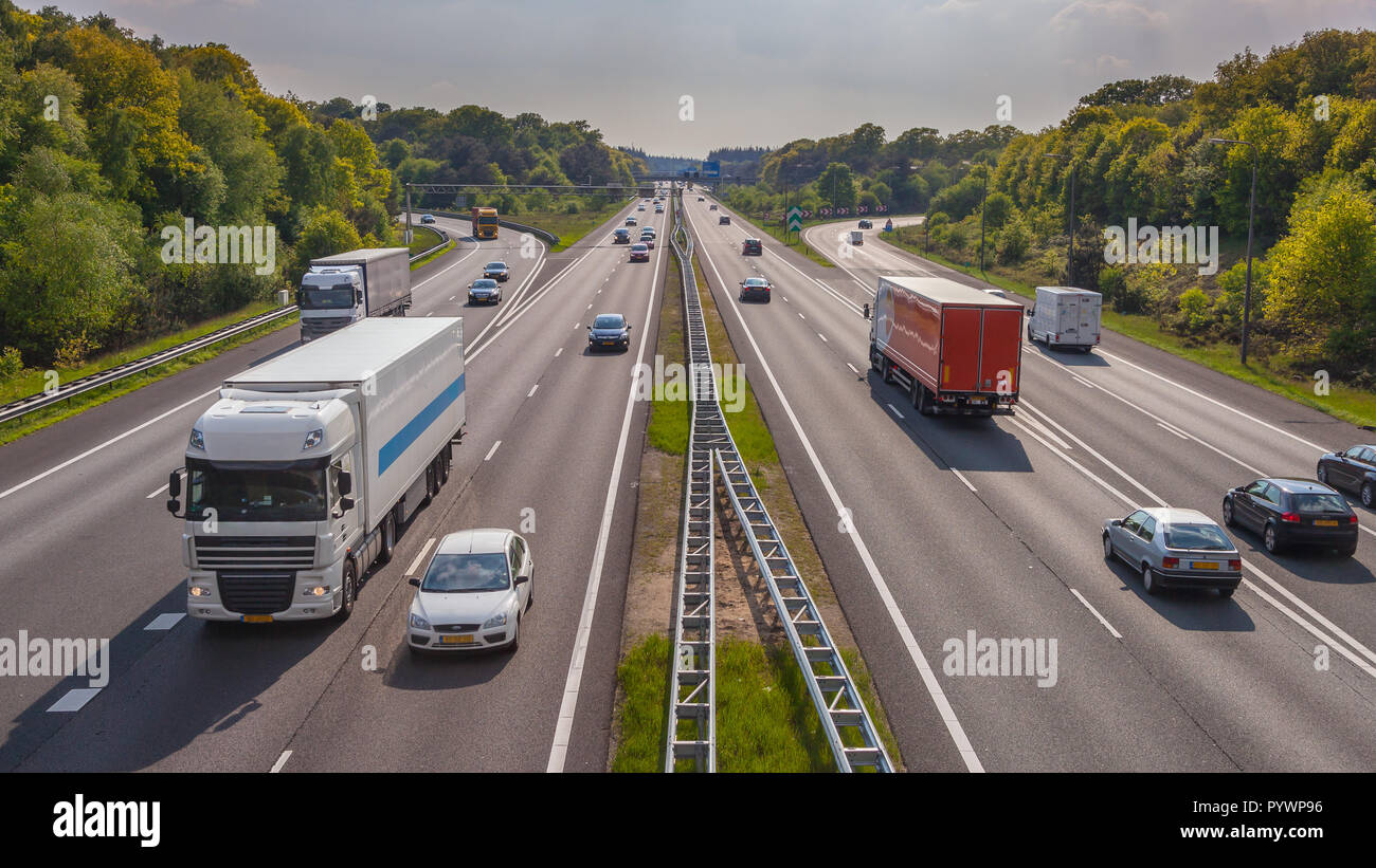 Evening motor Traffic on the A12 Motorway seen from above. One of the Bussiest highways in the Netherlands Stock Photo