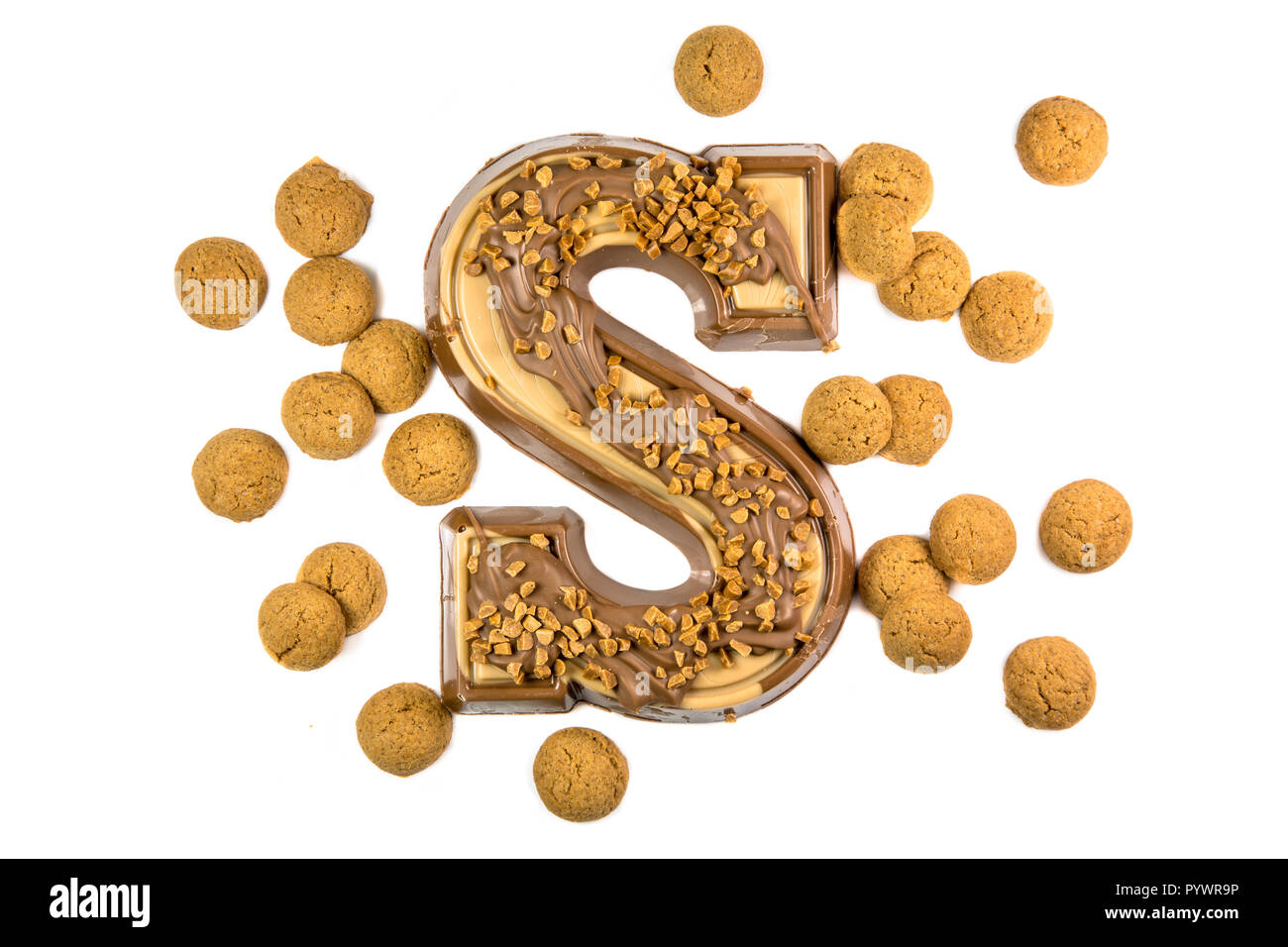 Decorated Chocolate letter with group of ginger nuts or pepernoten as ...