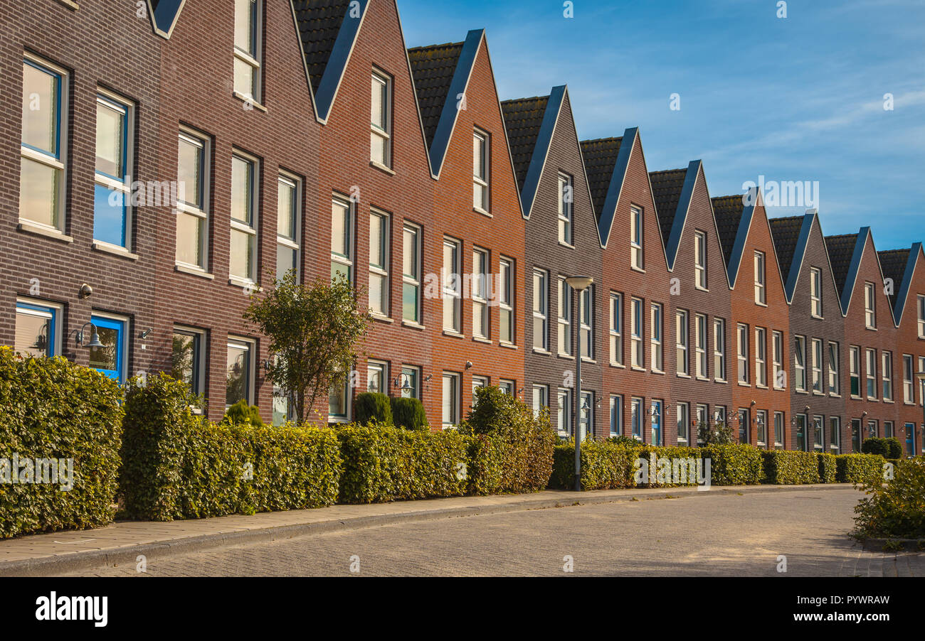 Facade in row of Modern Real Estate Family houses in a suburban area in Europe Stock Photo