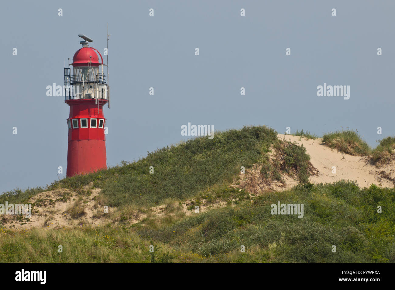 Classic iron lighthouse in the dunes on Schiermonnikoog, The Netherlands Stock Photo