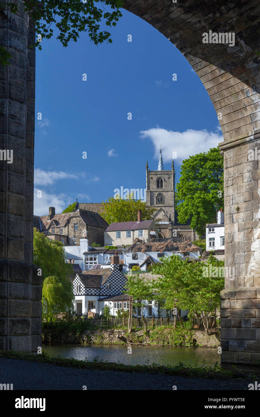 View of Knaresborough parish church and the town through one of the arches of the town's impressive railway viaduct Stock Photo