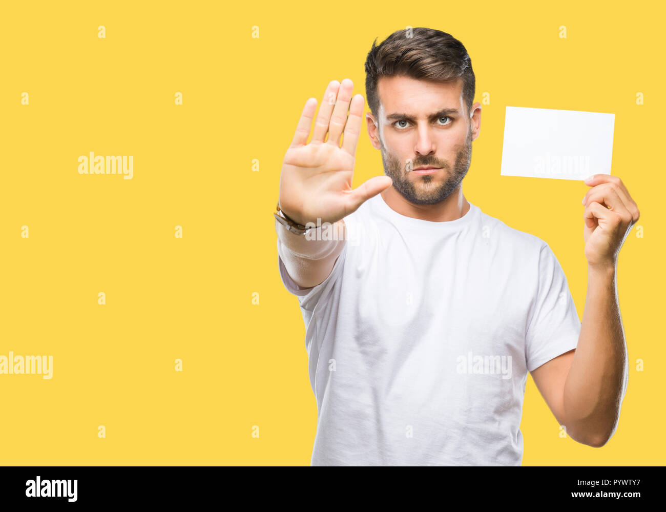 young handsome man holding blank card over isolated