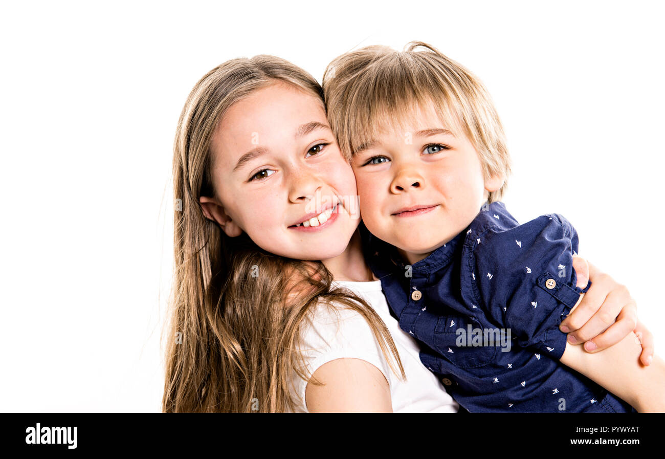A cute boy and girl on white background, happy real family Stock Photo Alamy