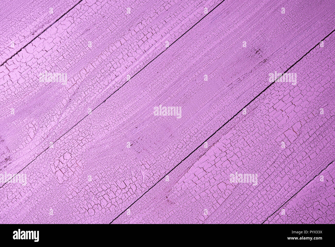 Close-up of aged natural wooden planks painted in beautiful pink color ...