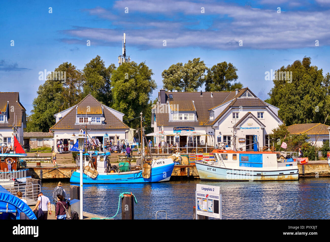 Fishing boats in Vitte at the harbor on a sunny beautiful day, Hiddensee island, Baltic Sea, Germany Stock Photo