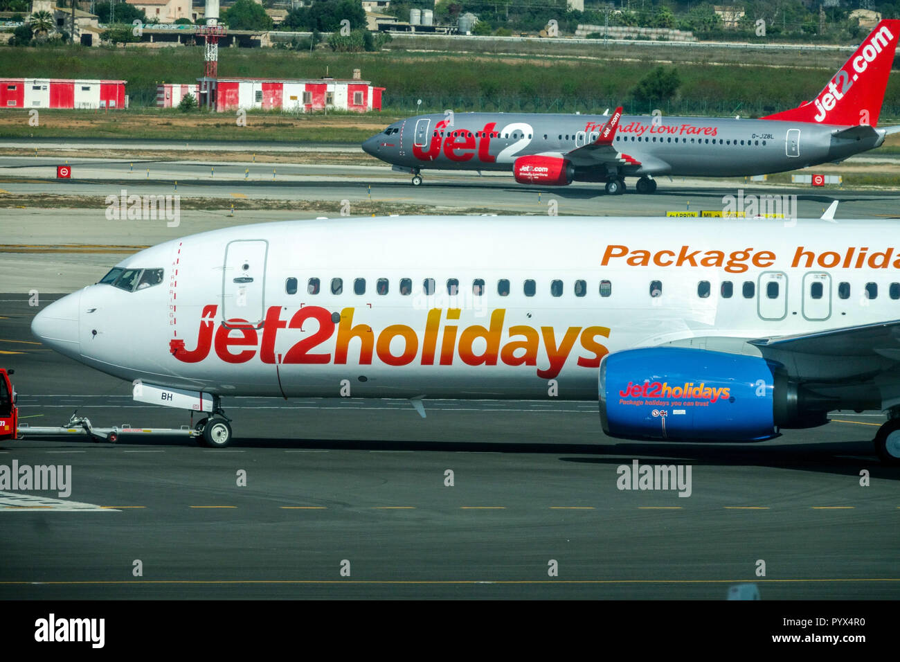 Boeing 737 Jet2holidays and Jet2 planes on the tarmac taxing, Palma de Mallorca Spain Stock Photo